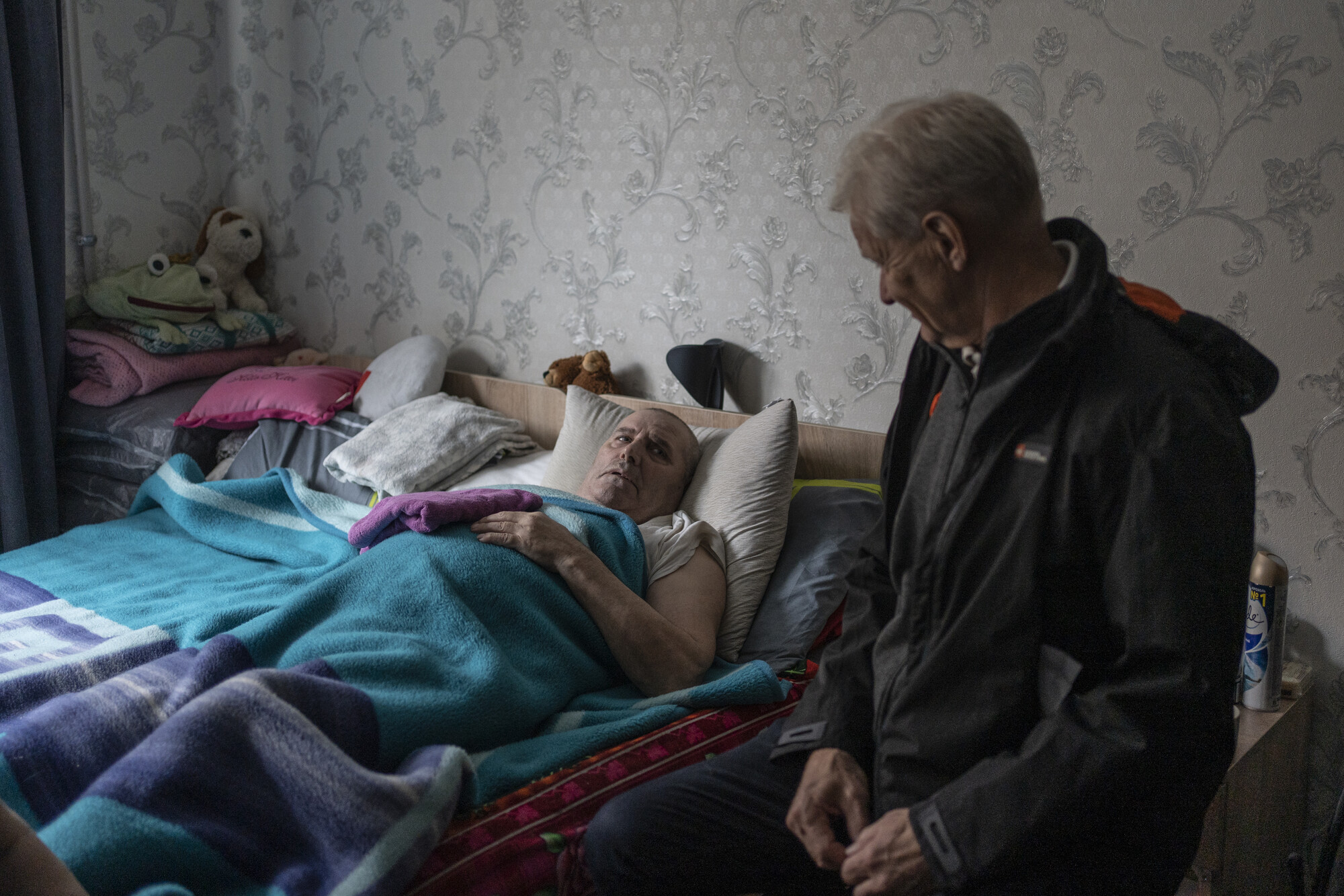 Jan Egeland's visit to IPD collective center in Dnipro, Ukraine. Serhii is from Donetsk. NRC rebuilt his house after it was attacked in 2016. This year, it was destroyed again by Russian rockets. His family fled on foot. Serhii had a stroke just before the war. His family pushed him for 18 hours in a wheelchair to safety. Dnipro, 22 November 2022.