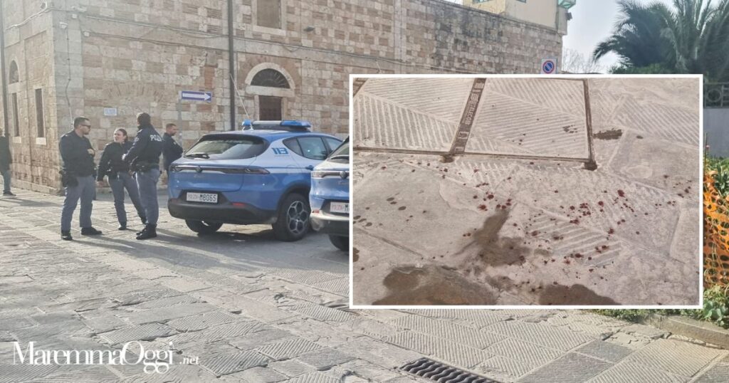 La polizia in via Saffi e una parte della scia di sangue