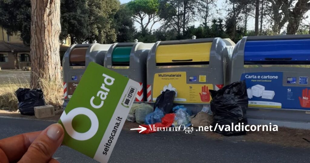 Una postazione di cassonetti e la Sei Card