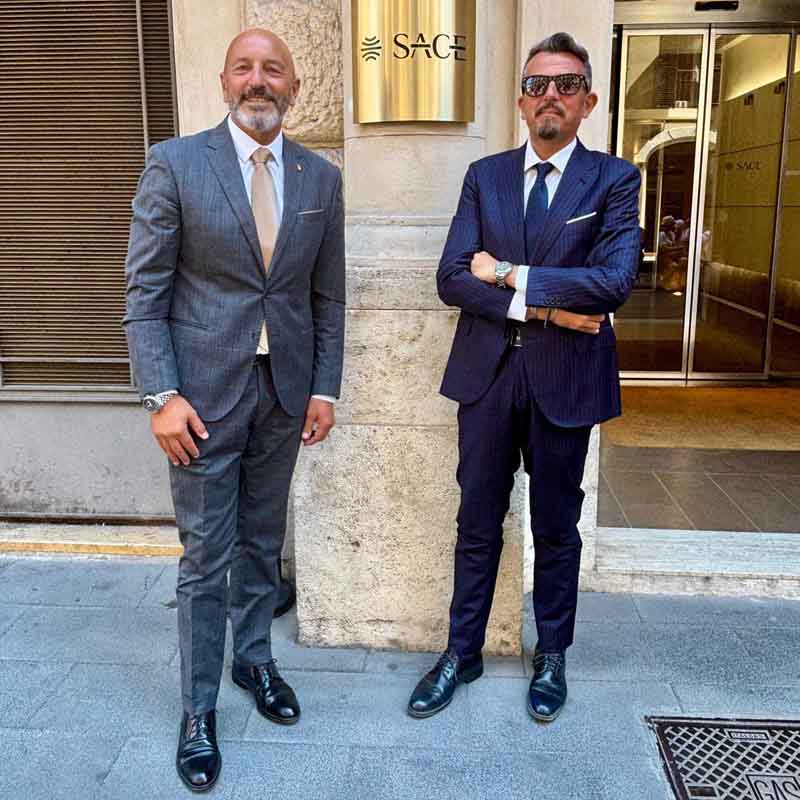 Fausto Turbanti e Federico Guidarelli davanti alla sede di Sace, a Roma