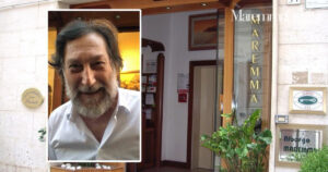 L'ingresso dell'Hotel Maremma, in centro storico a Grosseto, e Maurizio Peccianti
