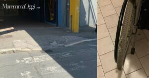 Il marciapiede e la ruota della sedie a rotelle spaccata